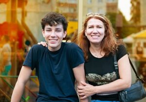 mother and son smiling while engaged in an aftercare program