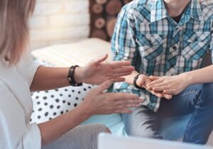 female therapist explaining dialectical behavior therapy to a client